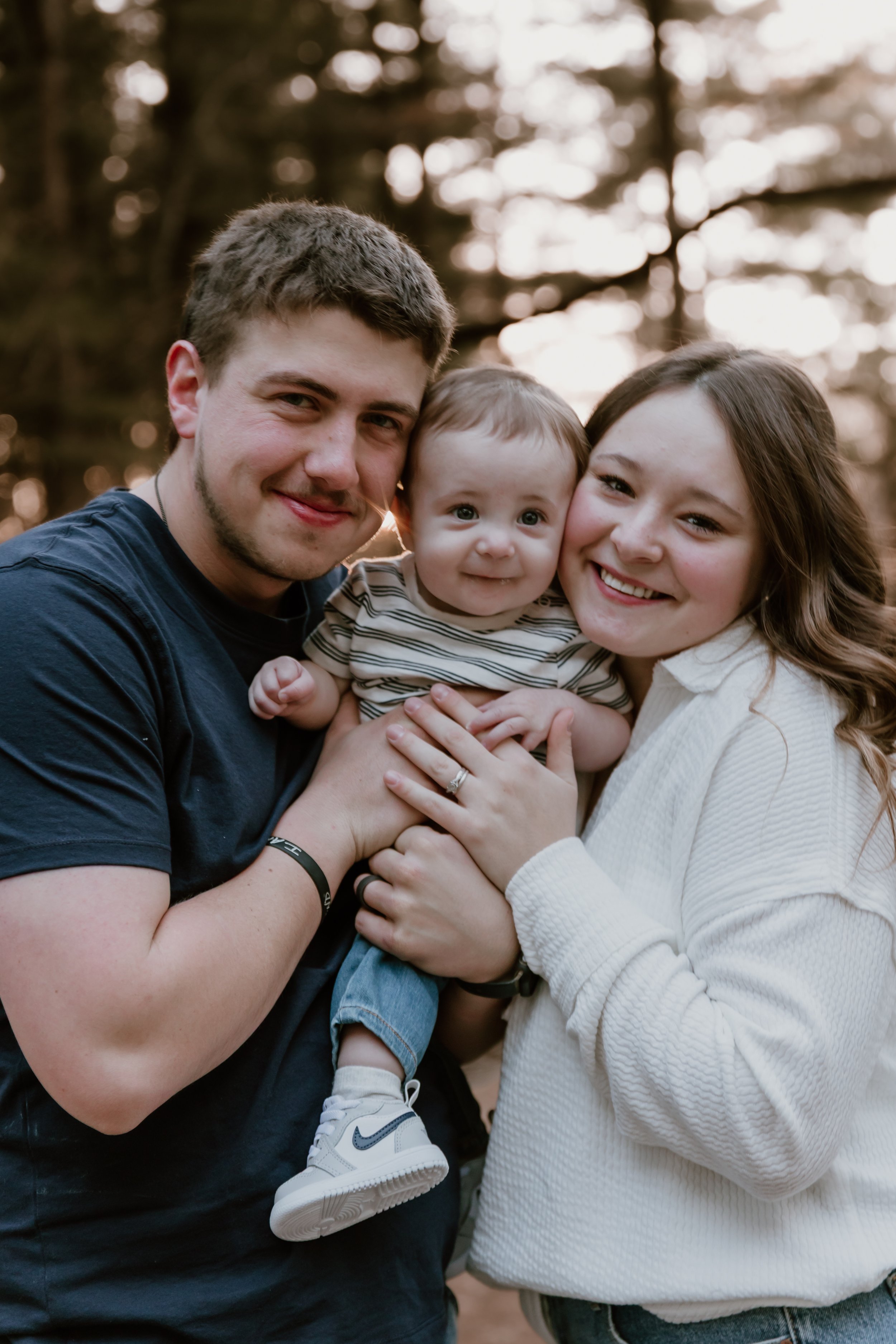 family with baby in central illinois at sunset