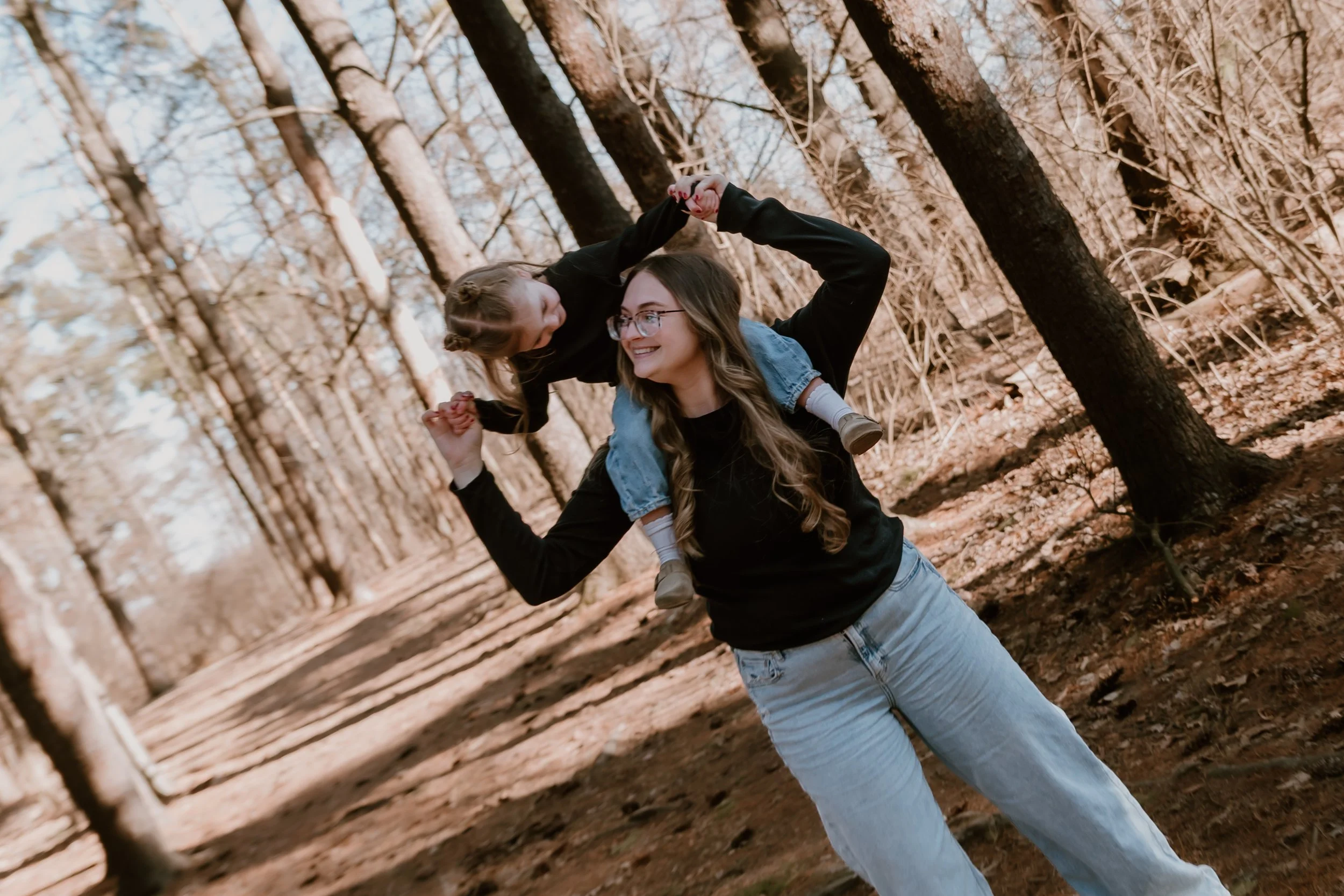 Lifestyle family photography image showing natural interaction and connection, photographed by a Peoria-area family photographer specializing in milestone sessions.