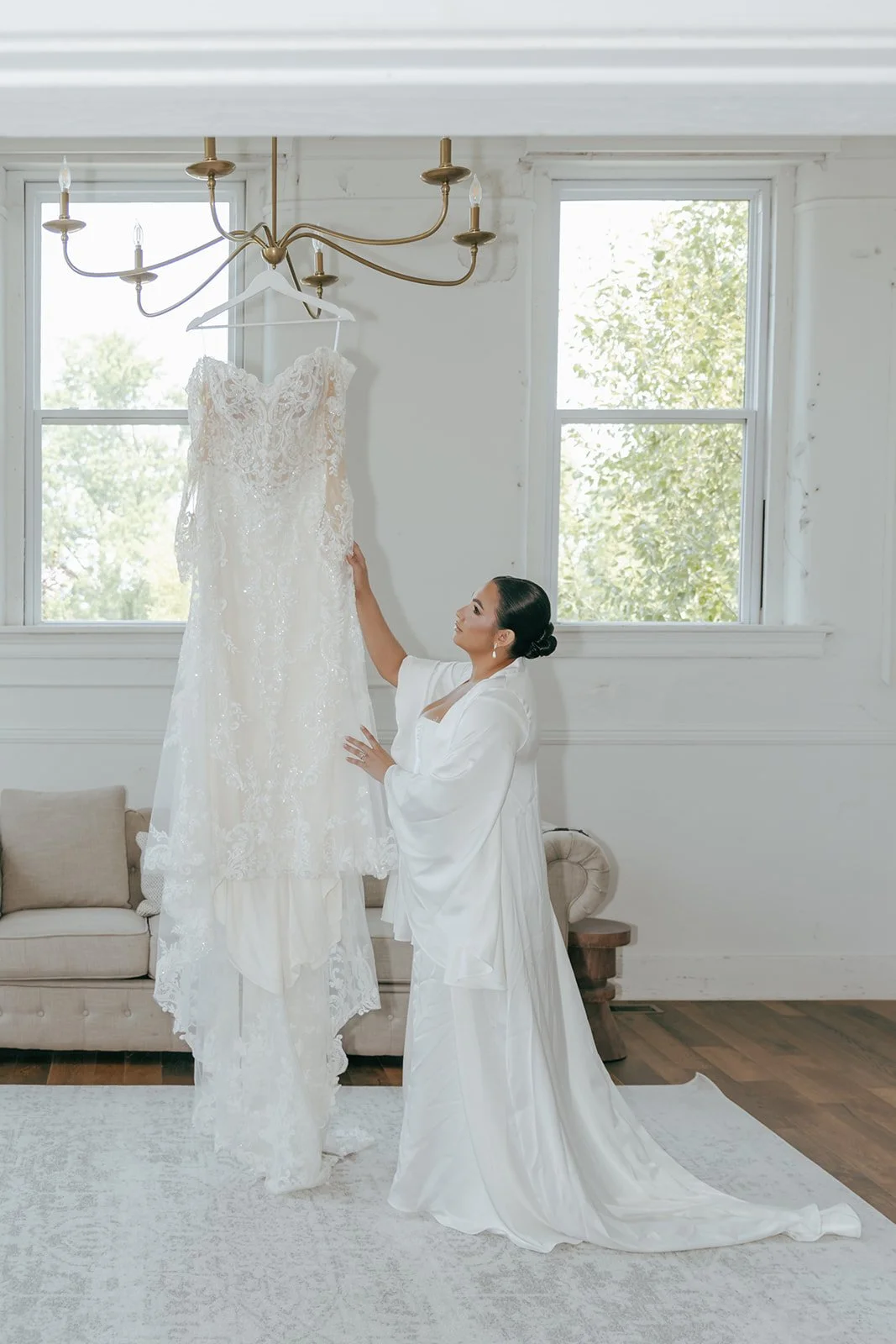 bride holding wedding dress inside bridal suite in the cannery in eureka illinois