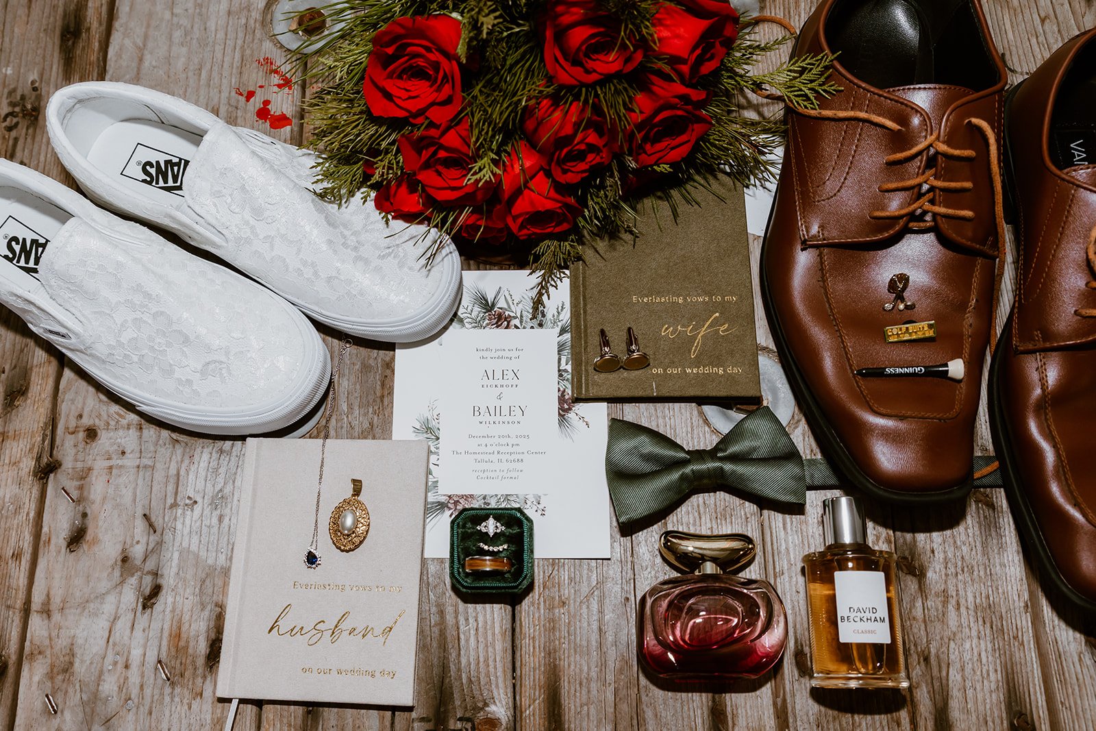 Wedding flat lay with red roses, invitations, rings and shoes