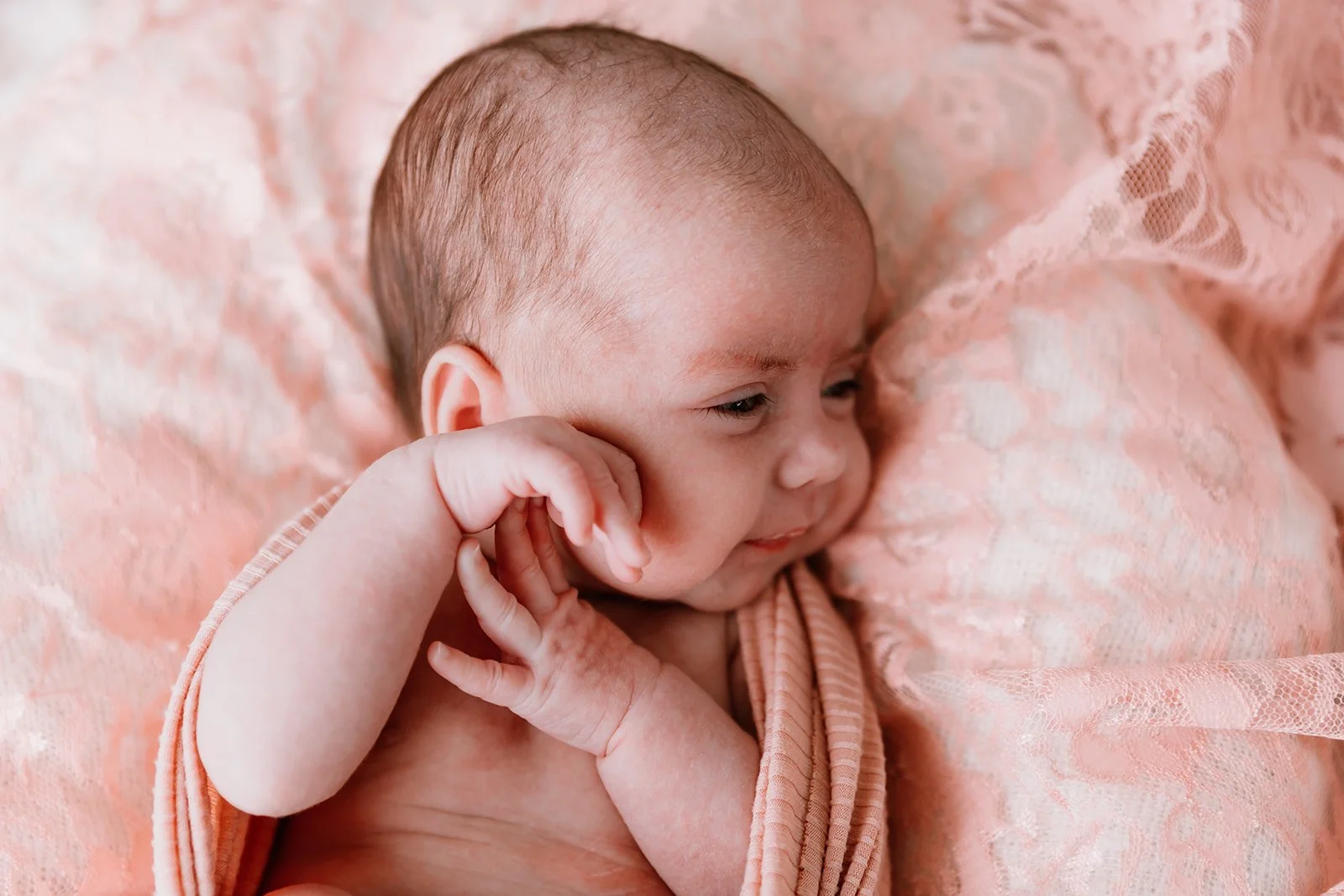 twin newborn session focused on connection in illinois studio