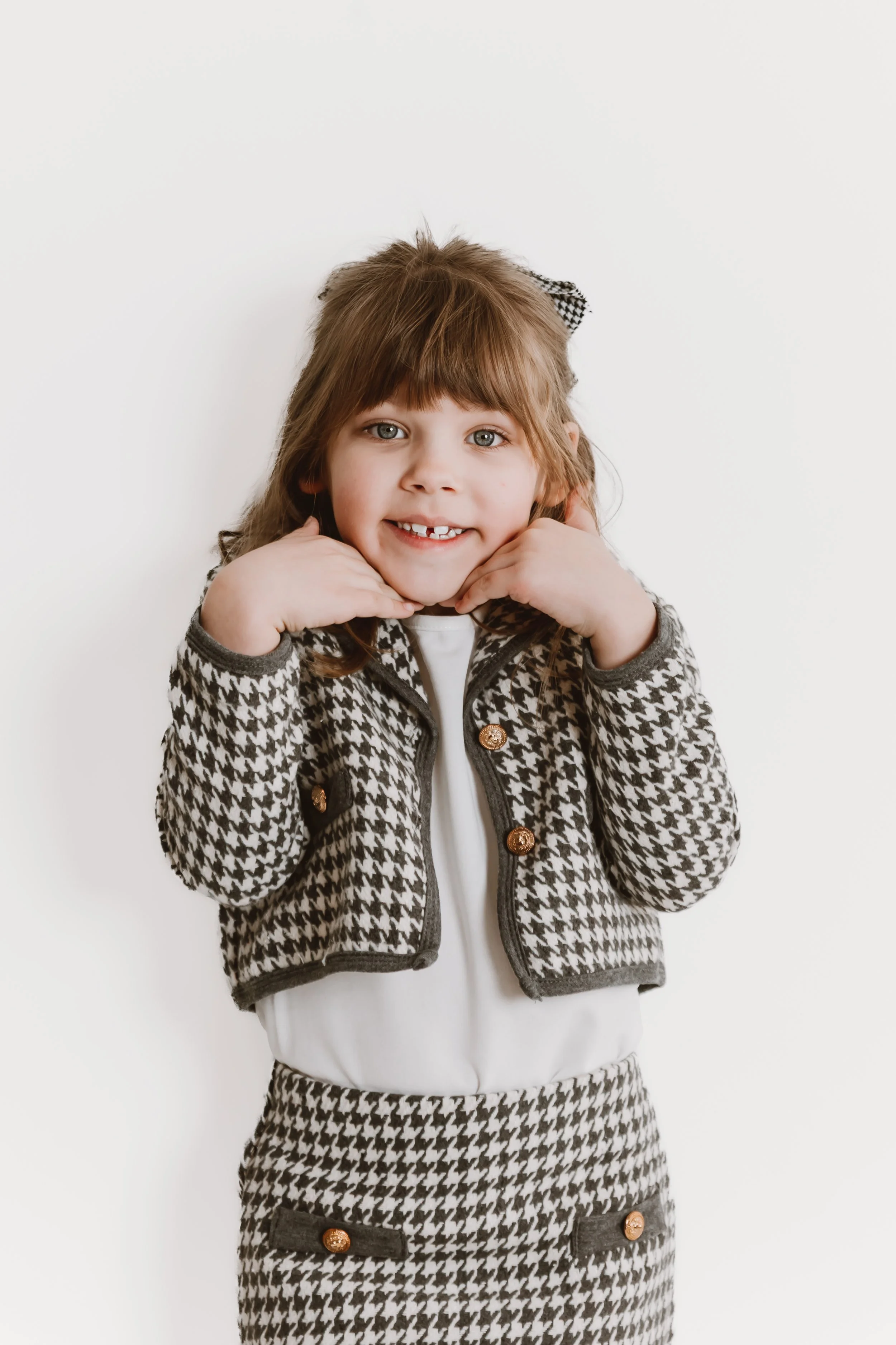 Sibling studio portrait in Peoria Illinois with coordinated outfits