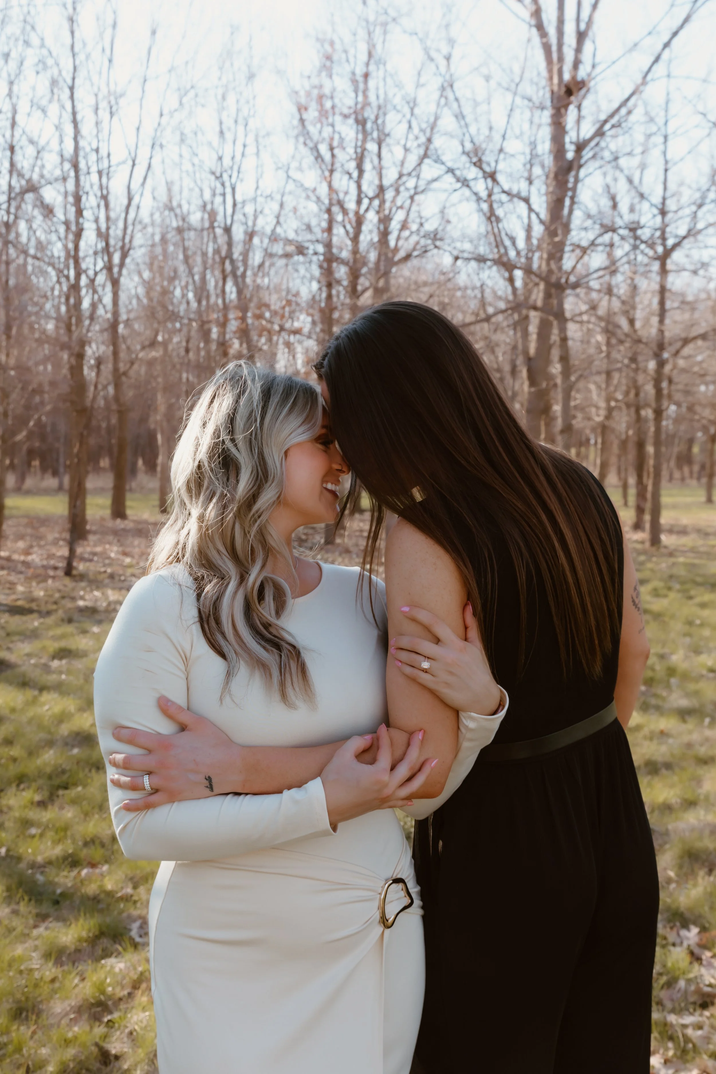 couple posing together after double proposal showing rings