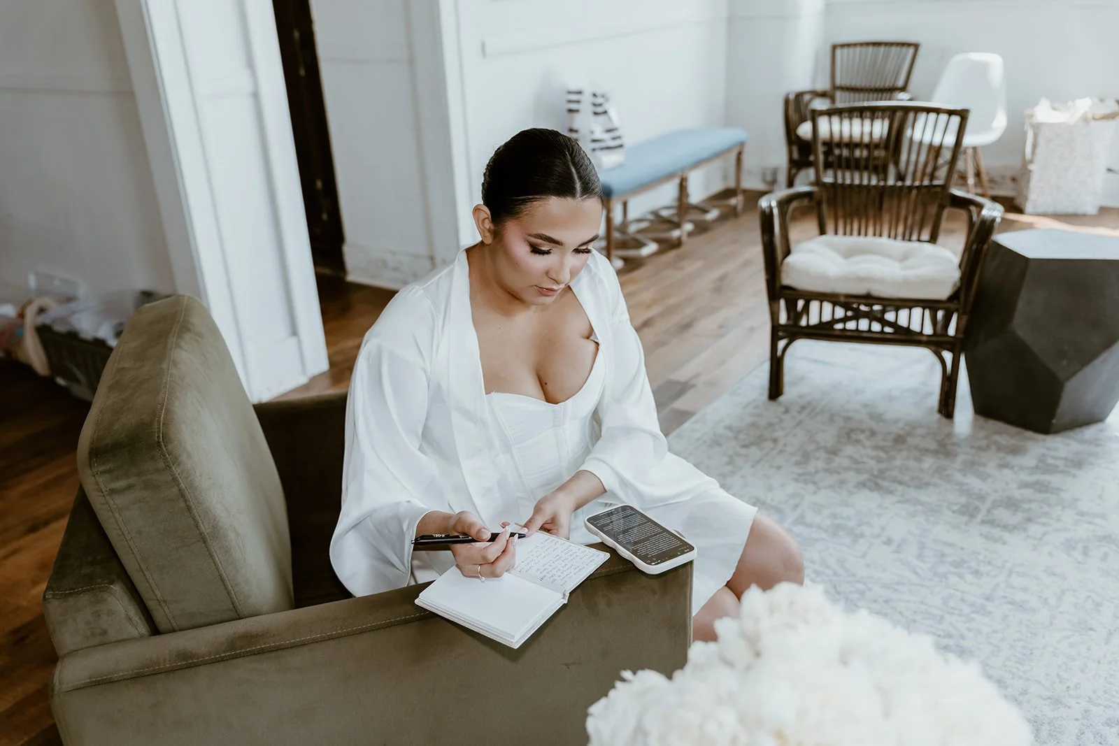 bride writing vows on seating inside of the bridal suite at the cannery in eureka illinois