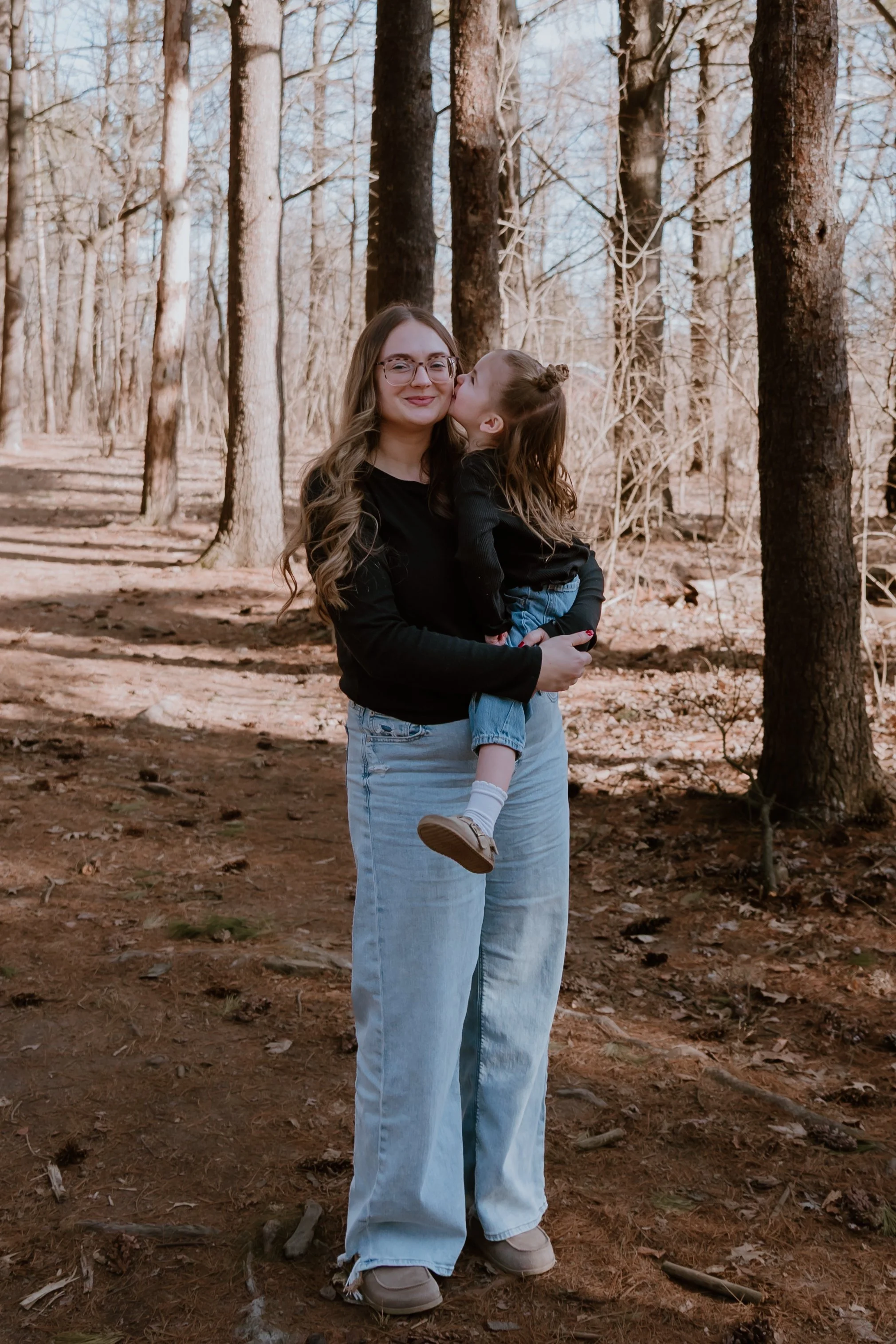 Documentary family photography session capturing motherhood and connection with a Peoria Illinois family photographer focused on real life and lasting relationships.
