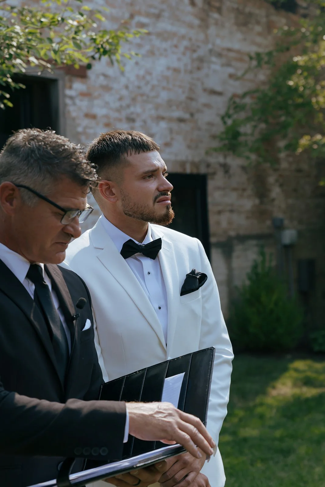 groom crying as bride walks down aisle