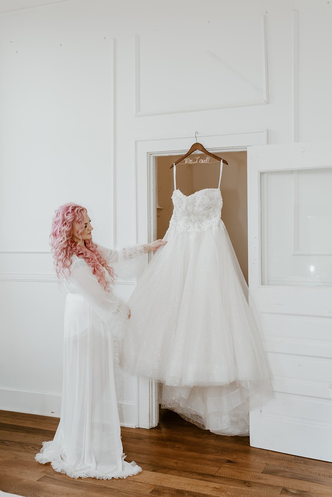 bride posing with wedding dress at wedding venue the Cannery in Eureka illinois