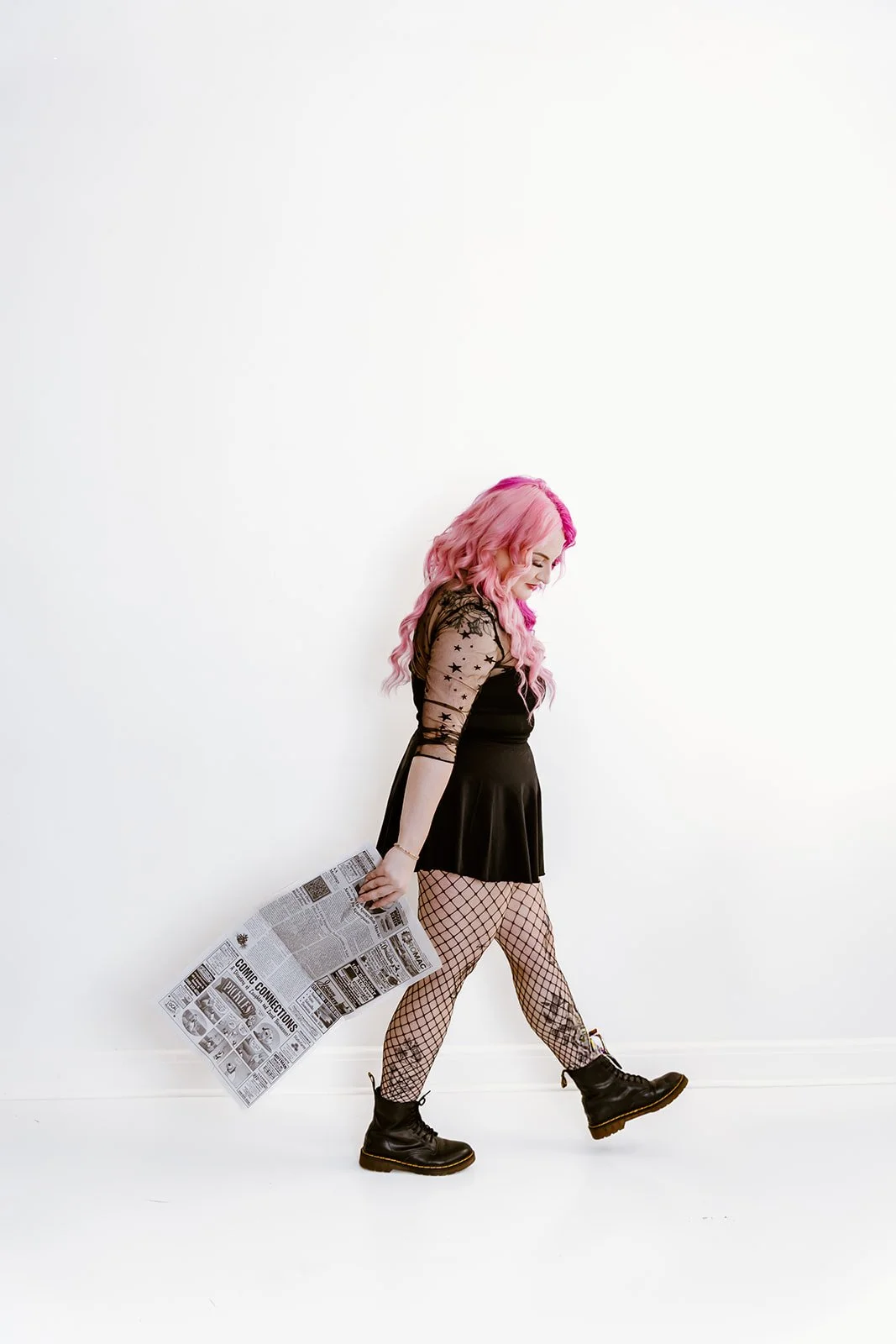 Peoria small business owner arranging products for photography session