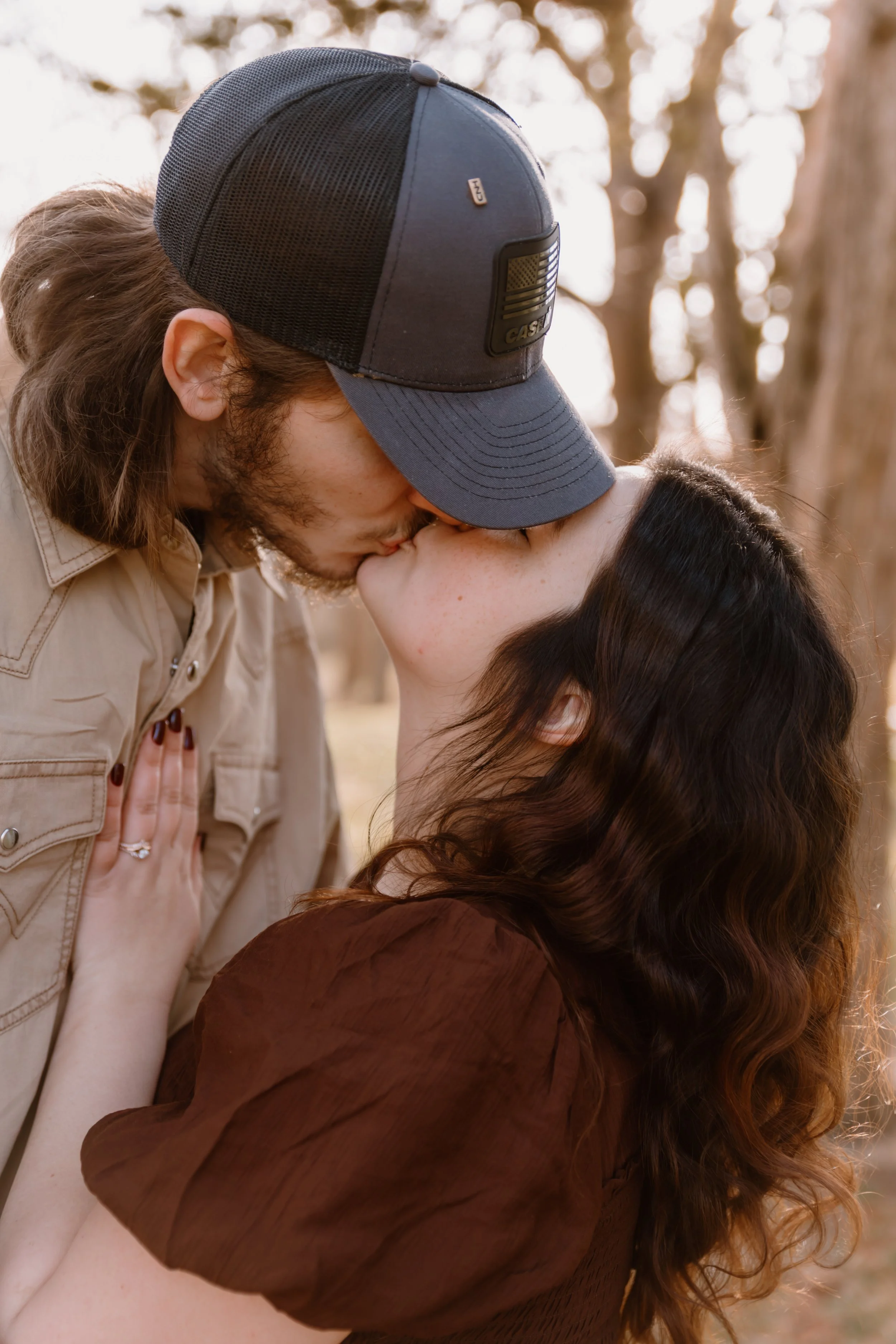 family of five posing together in wooded area central illinois
