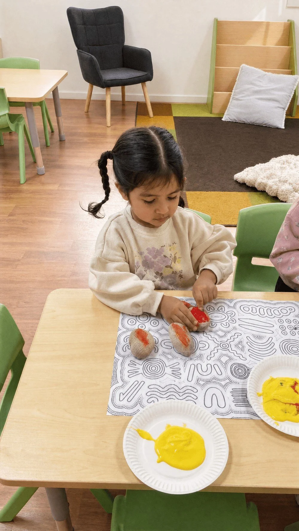 Child drawing at the activity table