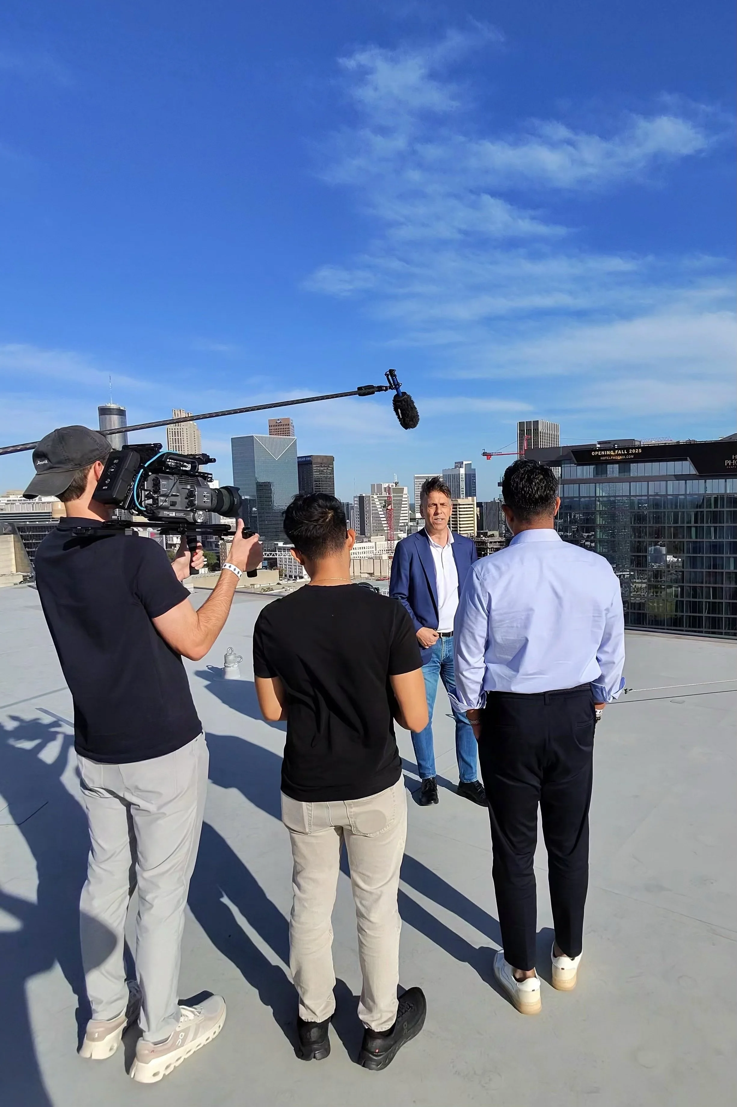 Production crew filming on a rooftop in Atlanta