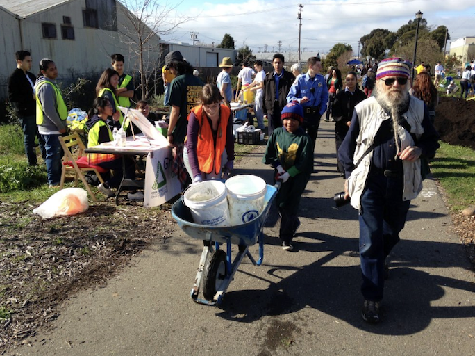 Volunteers planting and cleaning up debris at Richmond's Unity Park