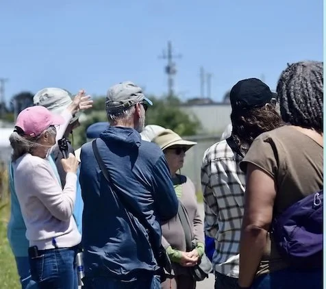 Group of people taking an in-person toxic tour of Richmond’s Zeneca site.