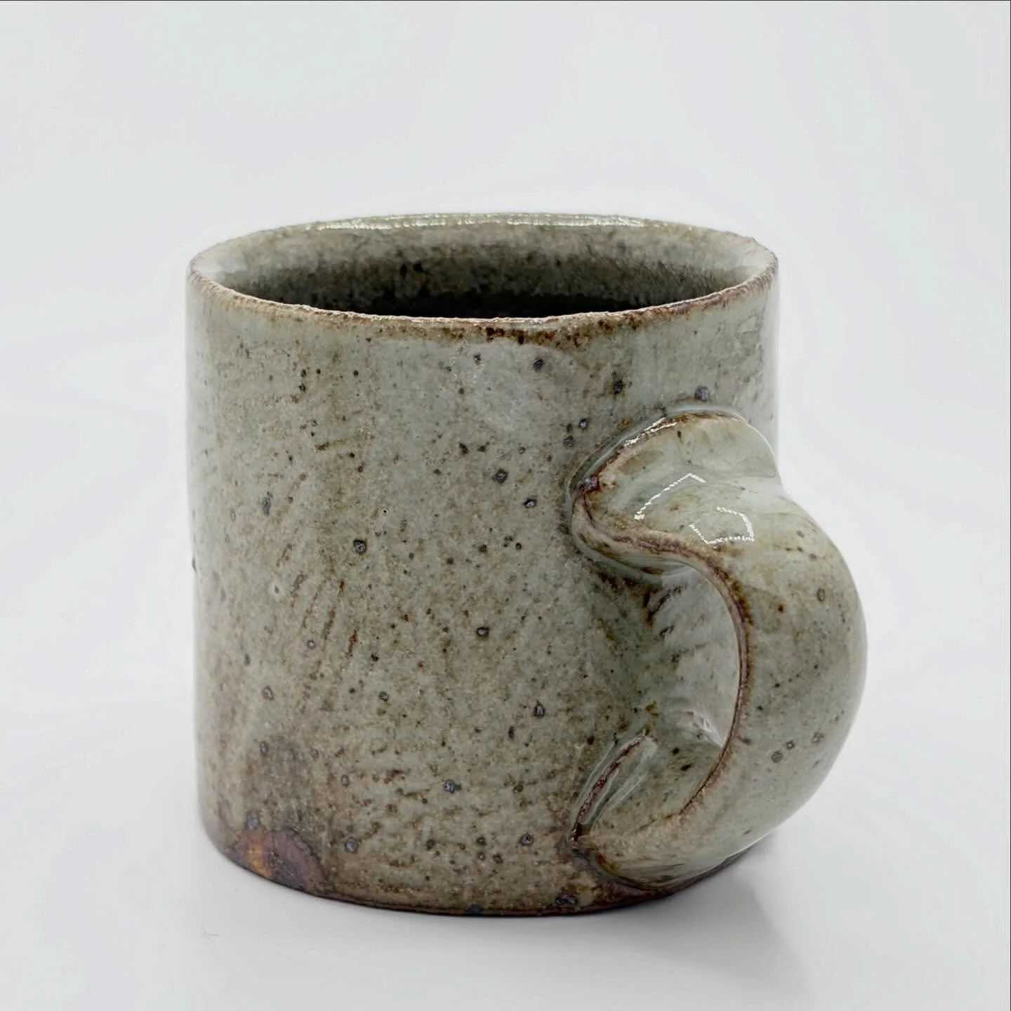 A textured mug. Holds 9 ounces which, studies have found, is a very good amount of ounces!

#ceramics #pottery #clay #wheelthrown #mug