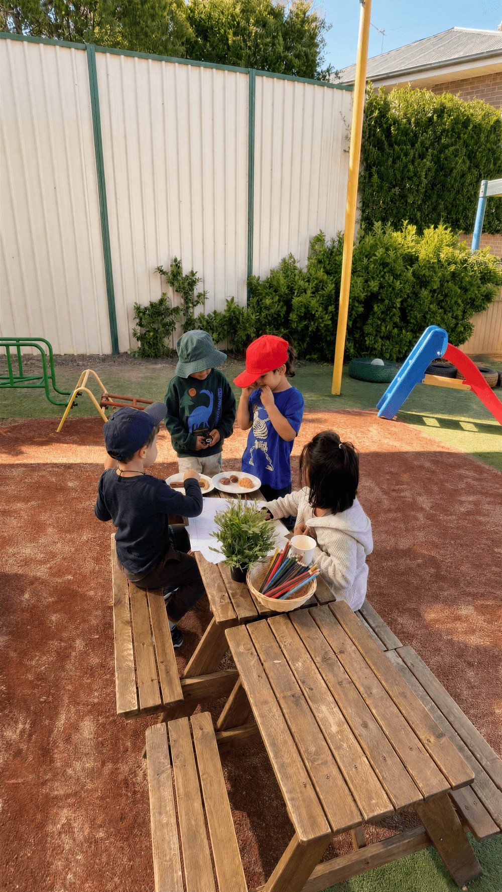 Children playing together in the outdoor play area