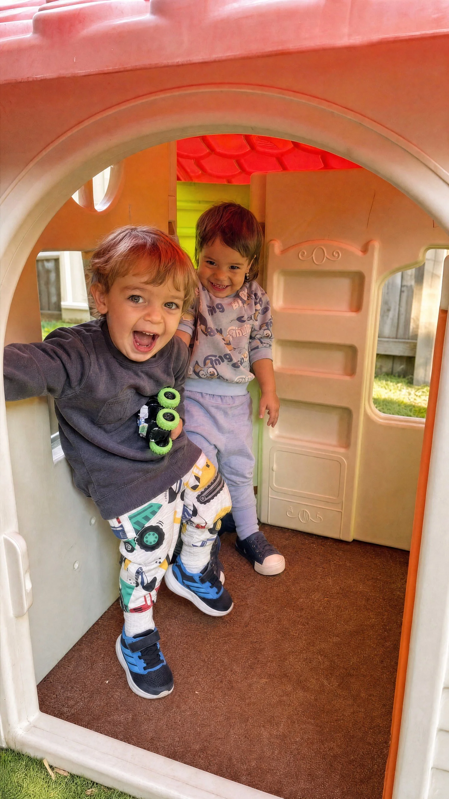 Happy children playing in the cubby house at Chipmunks Childcare