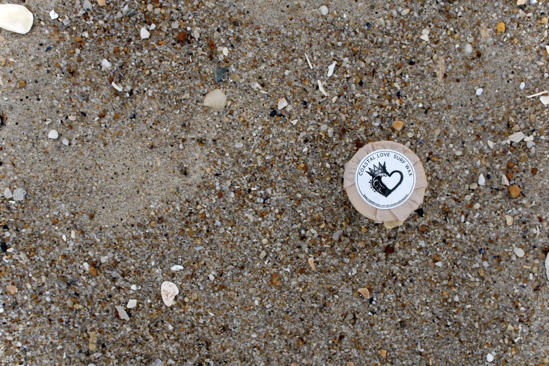 Coastal Love Surf Wax on Sand and Shells
