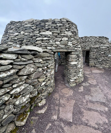Ancient stone structures with arched entrances at a historical site