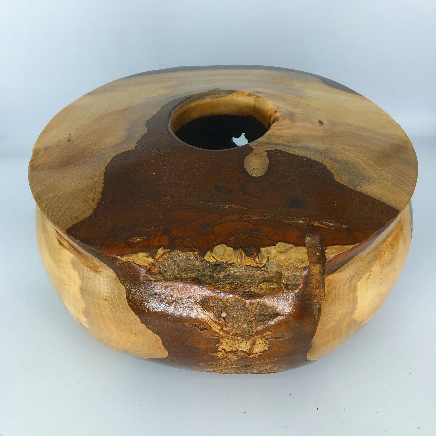 I have no idea what kind of wood this is but I think it is one of the most colourful I've ever done.

It is approximately 11 inches in diameter and 5 inches high.

I'll be shipping my pieces off to galleries where they get marked up. Get it before th