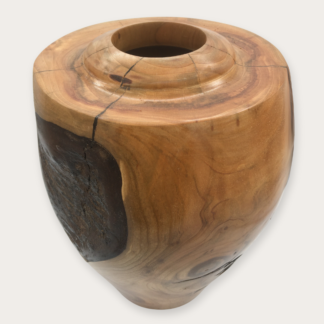 Cherry wood vase with closed top