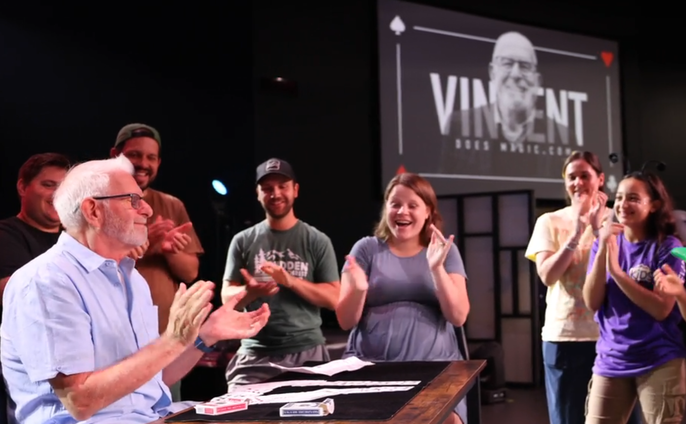 Vincent La Padula performing interactive close up magic for a live audience