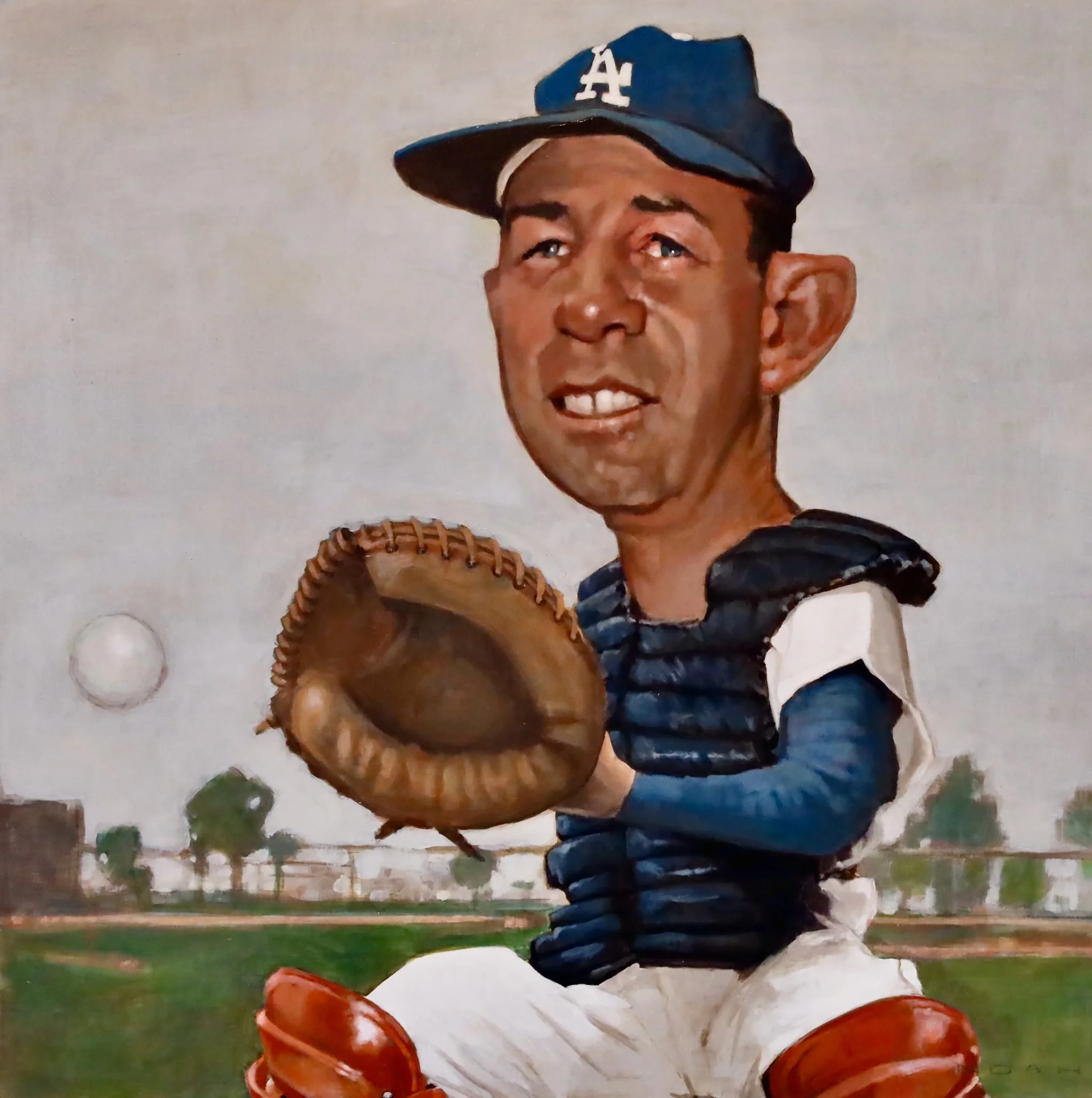 A baseball player wearing a blue cap with a white 'A' and 'L' logo, a black and white uniform, and red cleats, holding a brown baseball glove, on a grassy field with trees and a brick wall in the background.