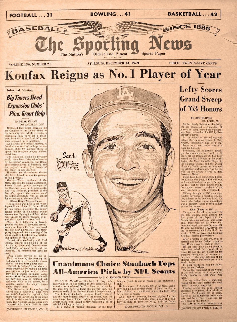 Front page of The Sporting News newspaper, dated December 14, 1963, featuring a large illustration of Sandy Koufax in a Dodgers cap, headline about Koufax winning Player of the Year award, a smaller illustration of Koufax pitching, and articles about sports achievements.