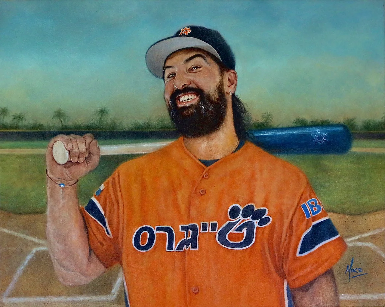 A man with a beard and a baseball cap holding a baseball bat, wearing an orange sports jersey with Hebrew and English letterings, standing on a baseball field with a mural of palm trees in the background.