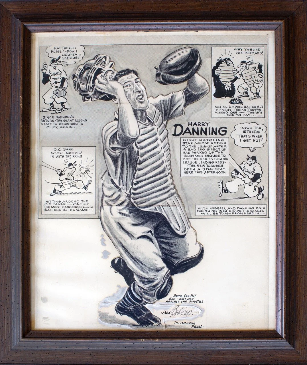 A framed cartoon drawing of baseball player Harry Danning catching a star, with speech bubbles and captions about his performance, featuring characters from a comic strip style and text about the Giants and baseball.