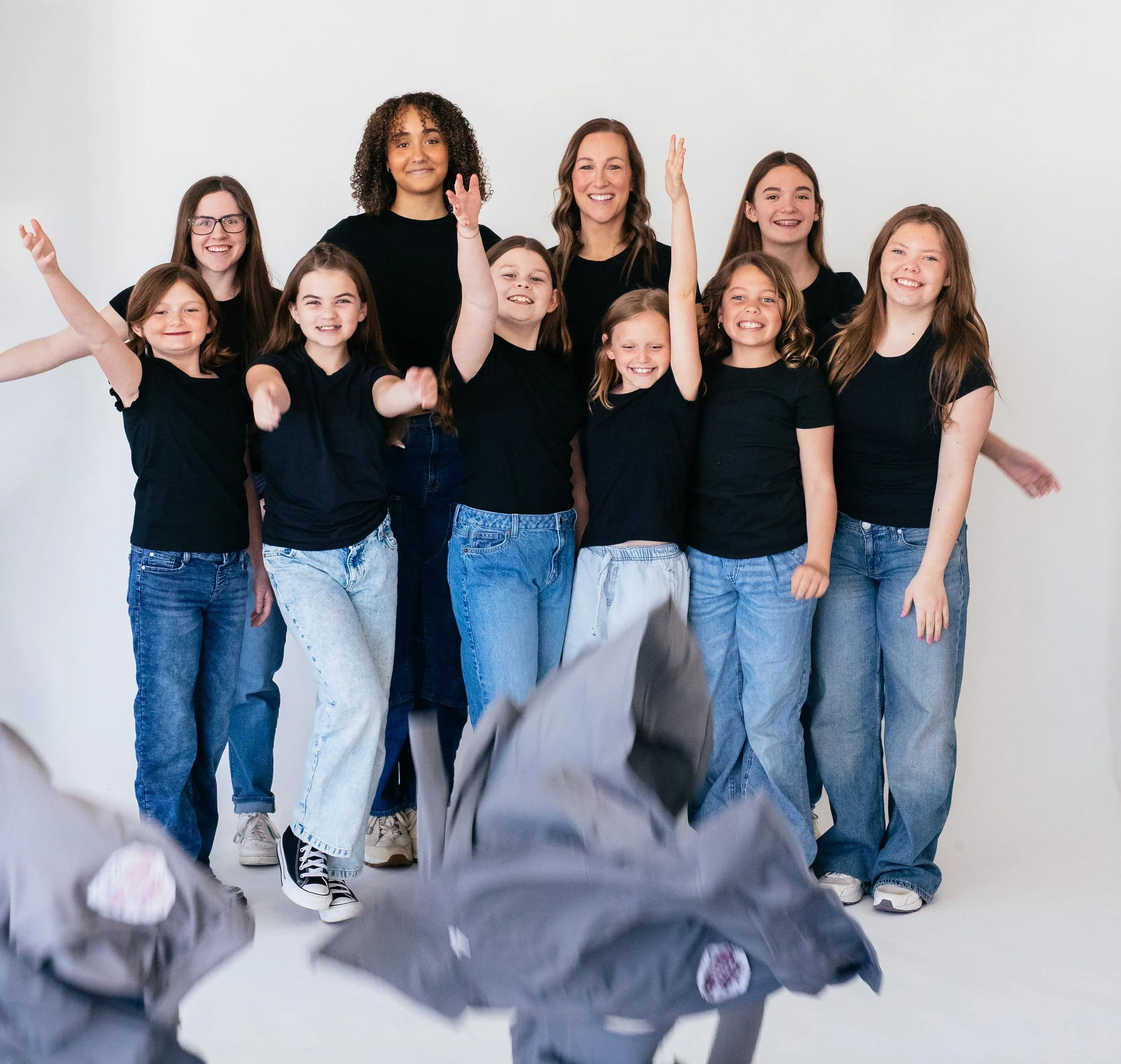 Dance Factory East instructors and competition team student leaders celebrating together at the studio in LeRoy, Illinois.