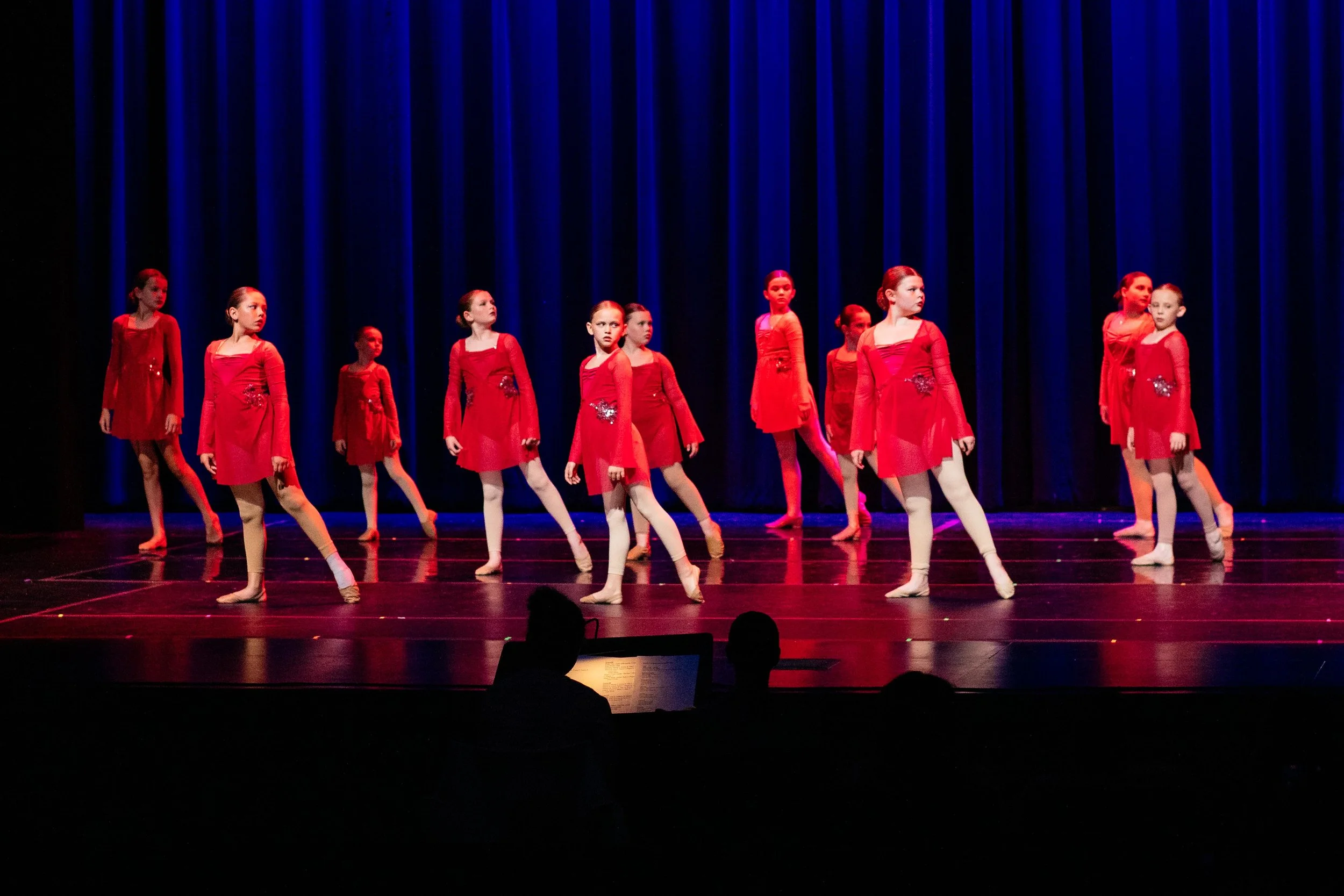 Intermediate dance class performing a recital routine at Dance Factory East.