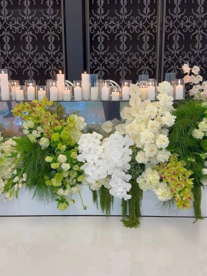 Calani &amp; Jayden | Friday, 16 October at Curzon Hall.

An abundance of crisp whites and layered green tones. A modern, sophisticated palette that felt timeless, elegant and luxurious.

We created two statement floral installations framing the brid