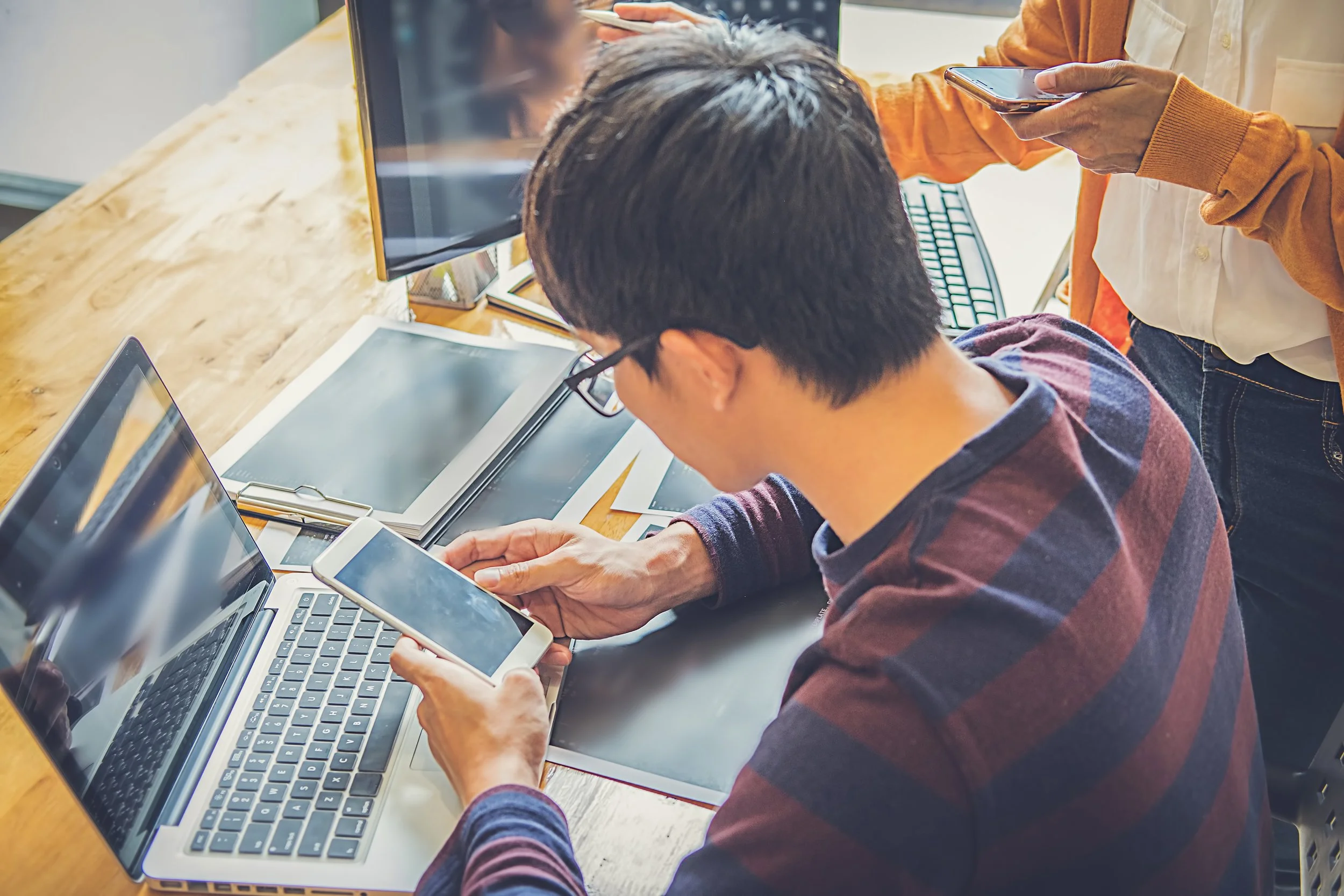 colleagues-using-digital-tablet-office.jpg