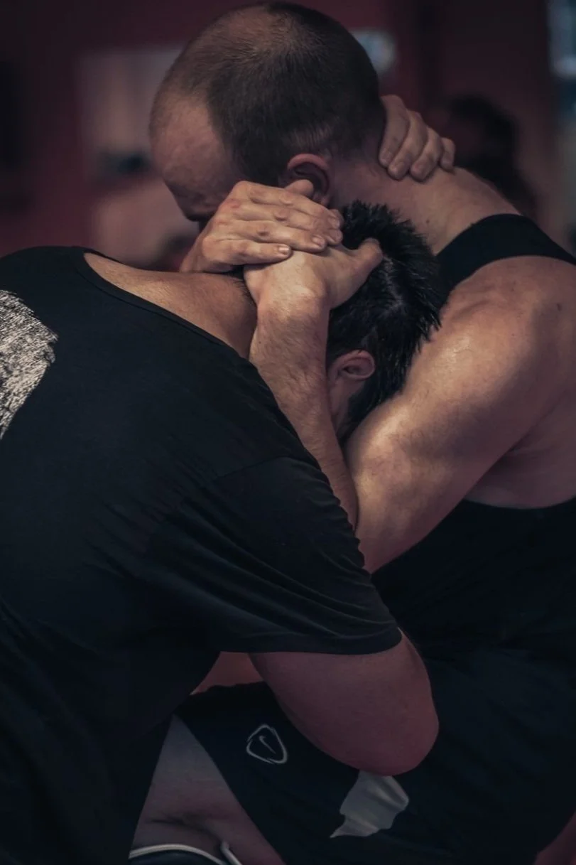 Two members drilling Muay Thai clinch work at JAI Thai Boxing, Auckland CBD