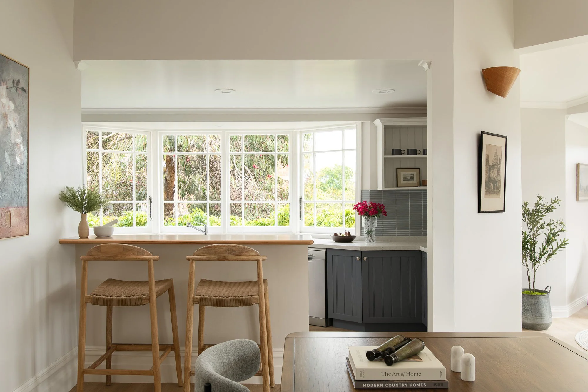 heritage kitchen with modern updates, blue kitkat splashback tiles farmhouse doors multi pane windows and timber bar stools