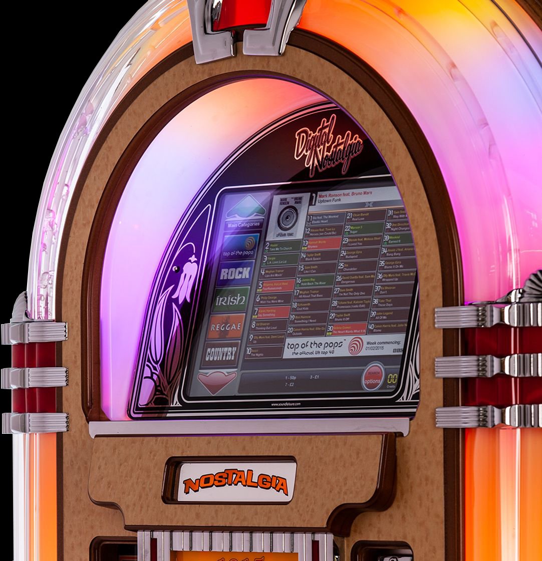 Close-up of a modern digital jukebox with a vintage design featuring colorful LED lighting, music selection screen displaying different genres like rock and country, and the word "Nostalgia" on the lower panel.