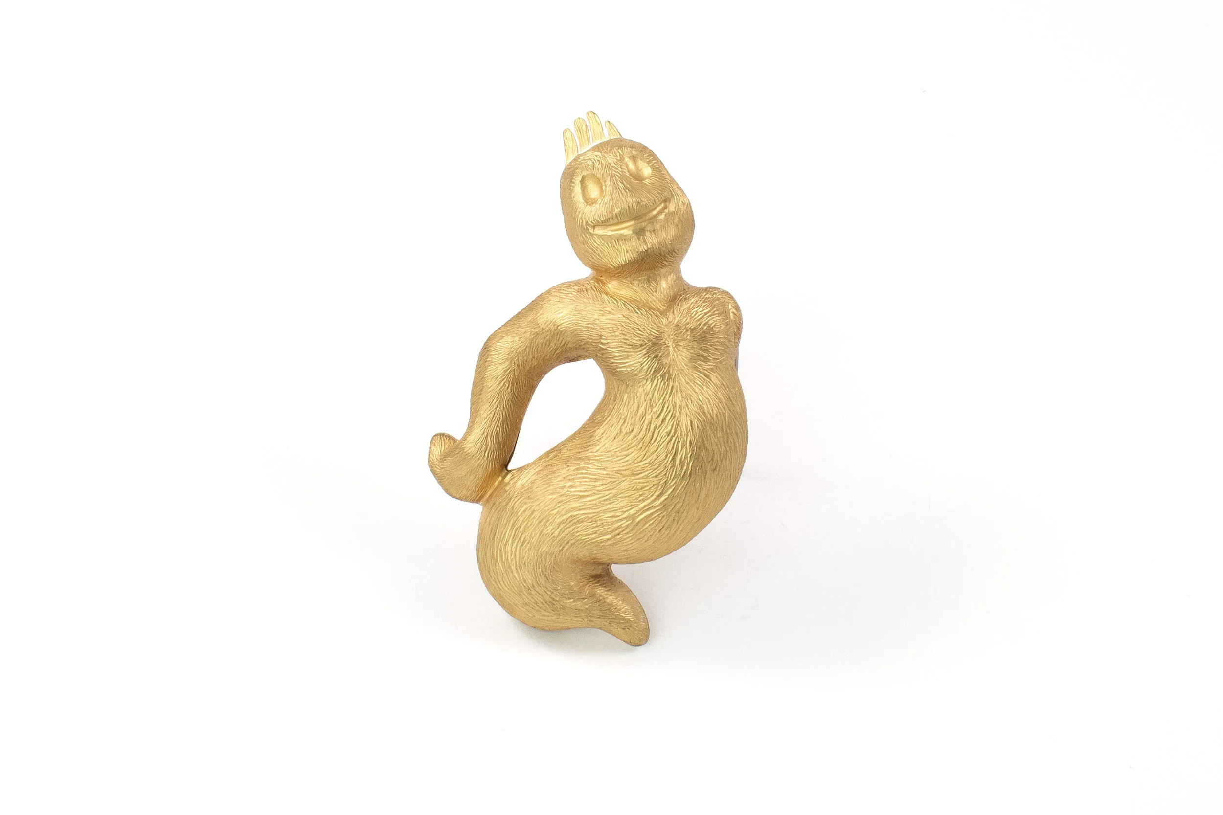   Adam Atkinson,   Golden Boy , 2023, Brass, spring steel, 3 x 2.5 x 1 in. Photo Credit: Artist.  