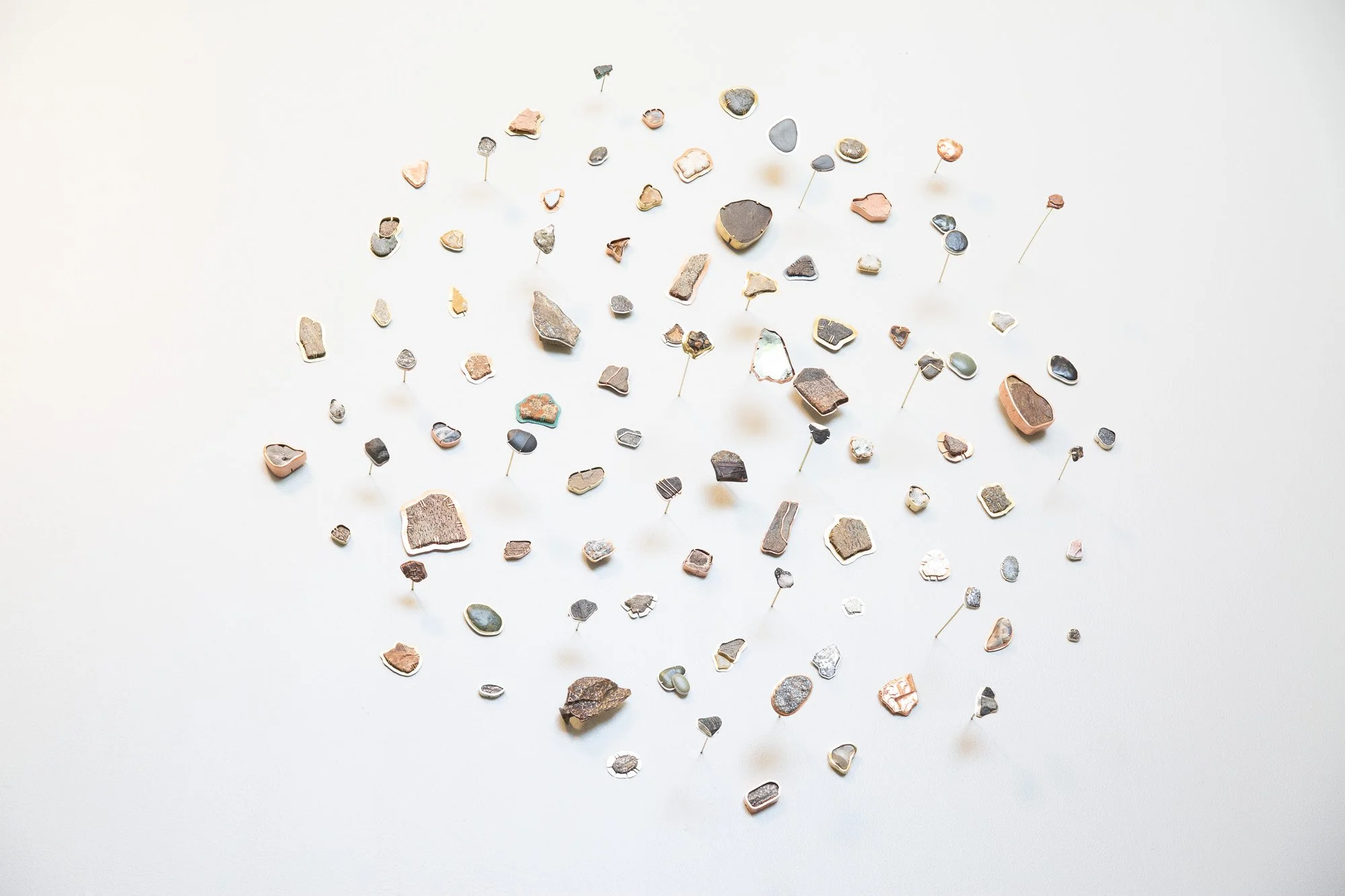   Shalena White,   Geological Alchemy III , 2019, found rocks and remnants, sterling silver, copper, bronze, and red brass. Photo Credit: Thomas Jack Hilton. 