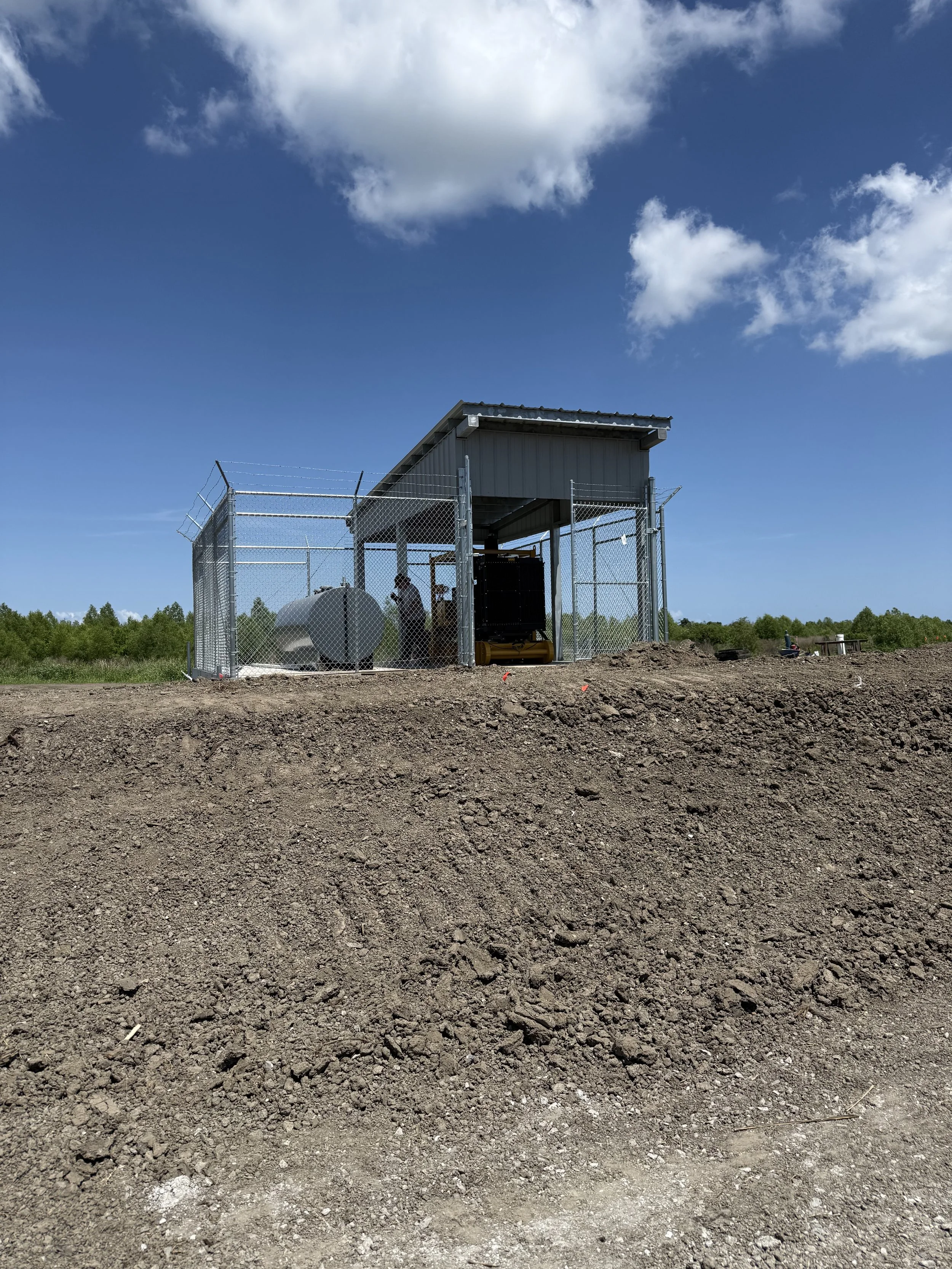 Pump Station Canopy and Fence Construction.  Structural steel fabricated, erected and metal roof and skirting installed.