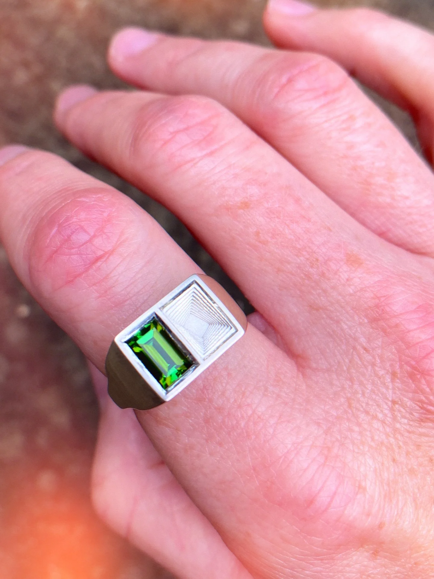 A green tourmaline set beautifully inside a solid silver signet-style ring with matching burnished swirling layers. 

The green ring is a one of a kind statement 💫

#ooak #oneofakindjewellery #solidsilverjewellery #tourmaline #greenjewellery