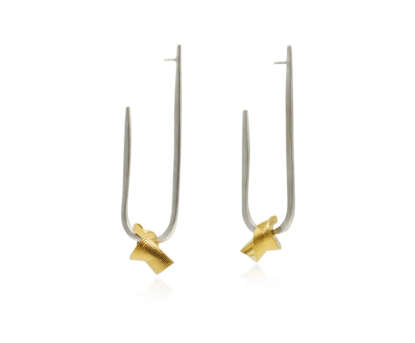 The Forward Earrings seen here in all sterling silver and a mixed metal version in silver and yellow gold. Really happy that they were also exhibited in the Goldsmiths&rsquo; Centre as part of the Spotlighting programme.