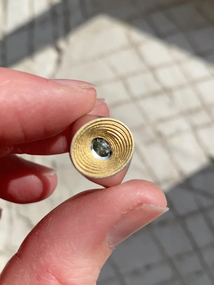 Spiral signet in sterling silver with 18ct gold layers and a sea green oval sapphire. Ready for a new home after exhibiting at the Goldsmiths&rsquo; Centre.