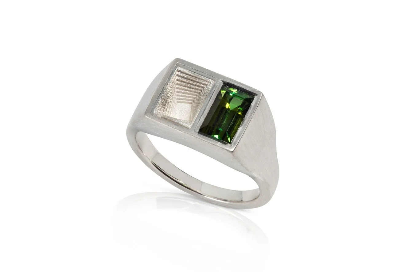 The first part of a new collection. PLURAL Green Ring. 

Crafted in sterling silver, The Green Ring features a striking 1.36ct baguette-cut green tourmaline. Bold and architectural, this signet ring is defined by its sculptural presence and considere