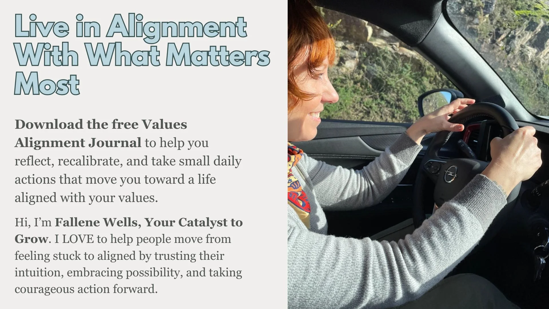 A woman with short, curly, red hair driving a car along a mountain road, smiling as she holds the steering wheel.