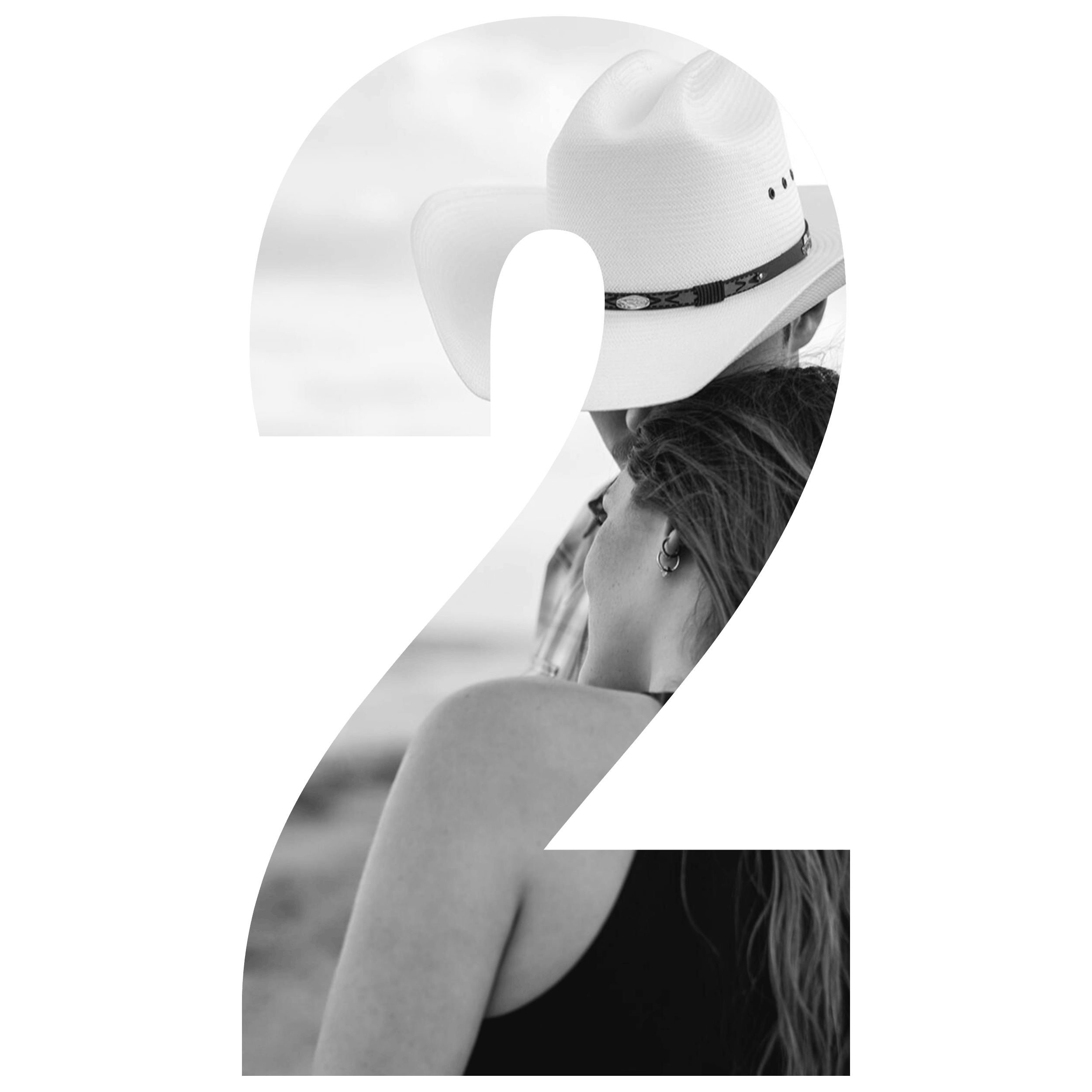 Black and white photo of a woman with long hair and earrings, and a woman wearing a wide-brimmed hat, sitting close to each other and facing away from the camera.