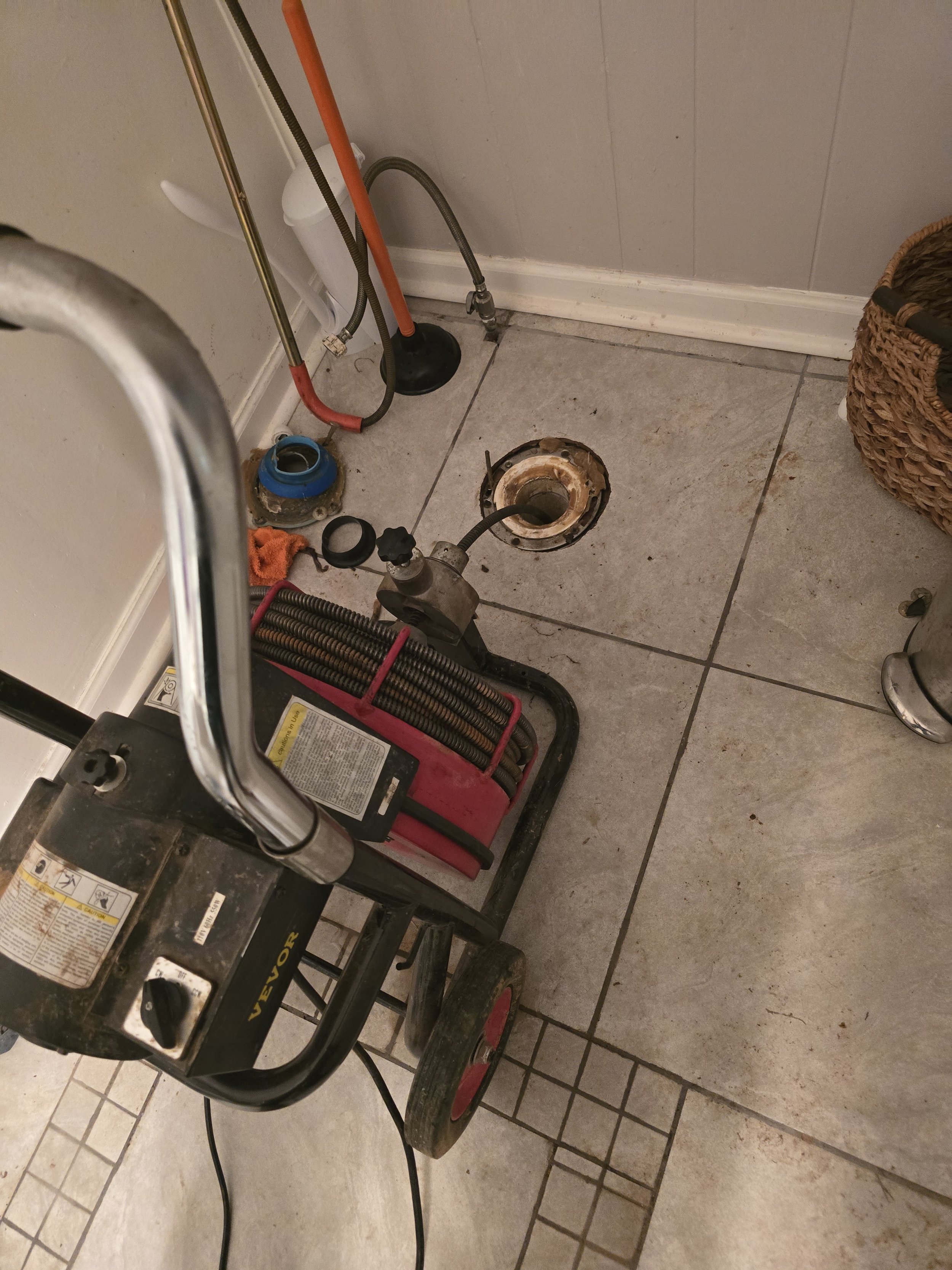 Professional drain cleaning equipment used to clear a clogged drain line