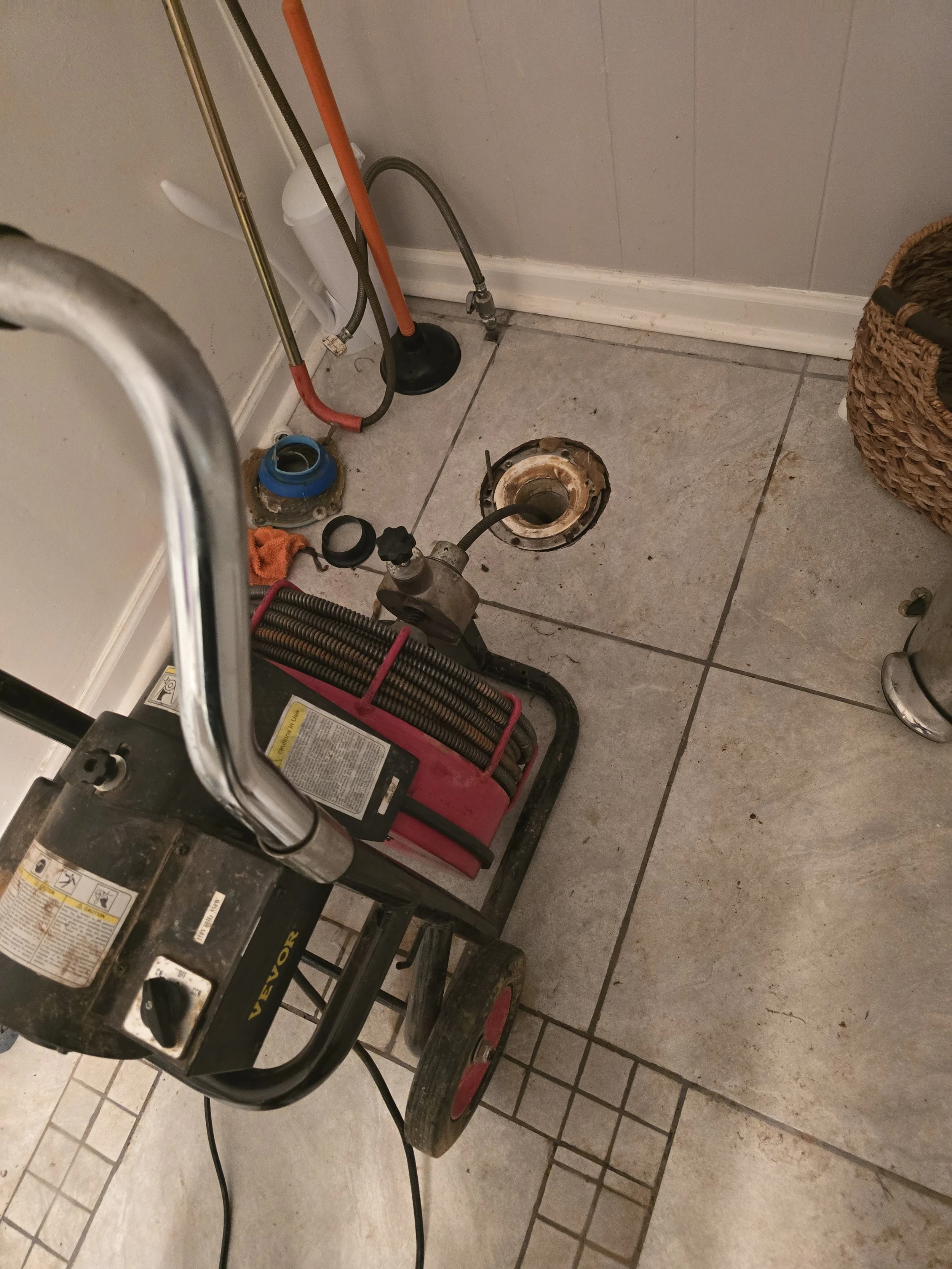 Drain cleaning equipment used to clear a clogged drain