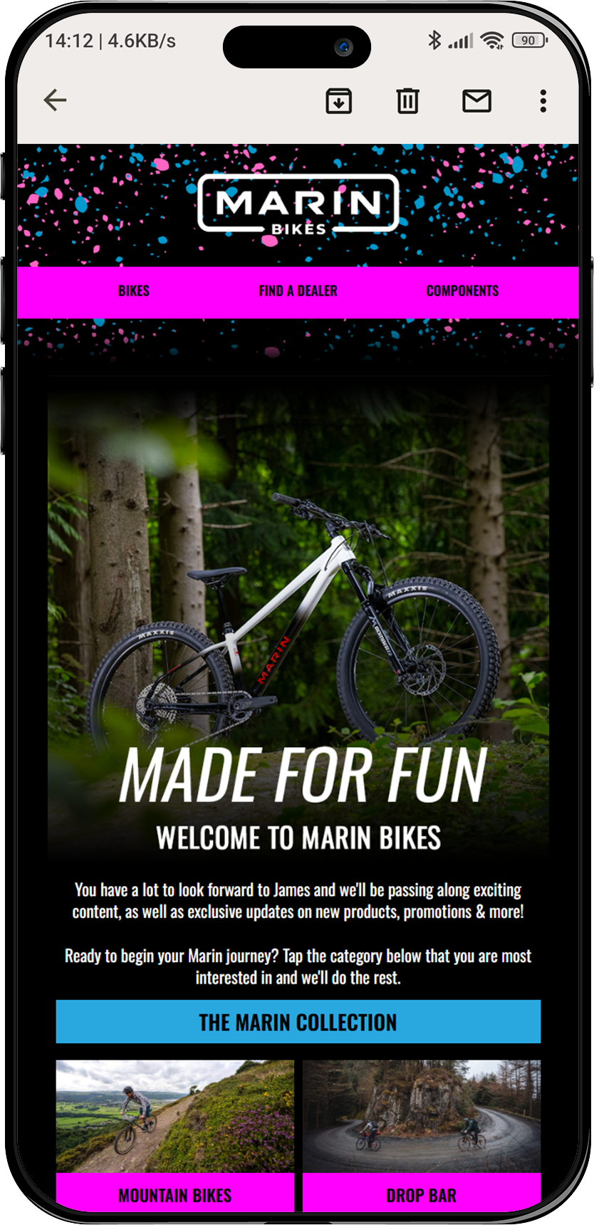 Smartphone displaying Marin Bikes webpage with menu options for bikes, dealer locator, and components. Features an image of a mountain bike in a forest setting and text "Made for Fun: Welcome to Marin Bikes." Lower section highlights the Marin Collec