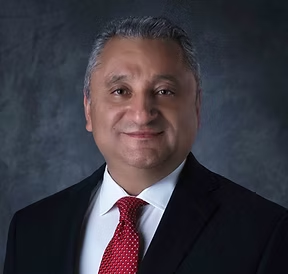 A photo of President Dr. Ercan Aydogdu.