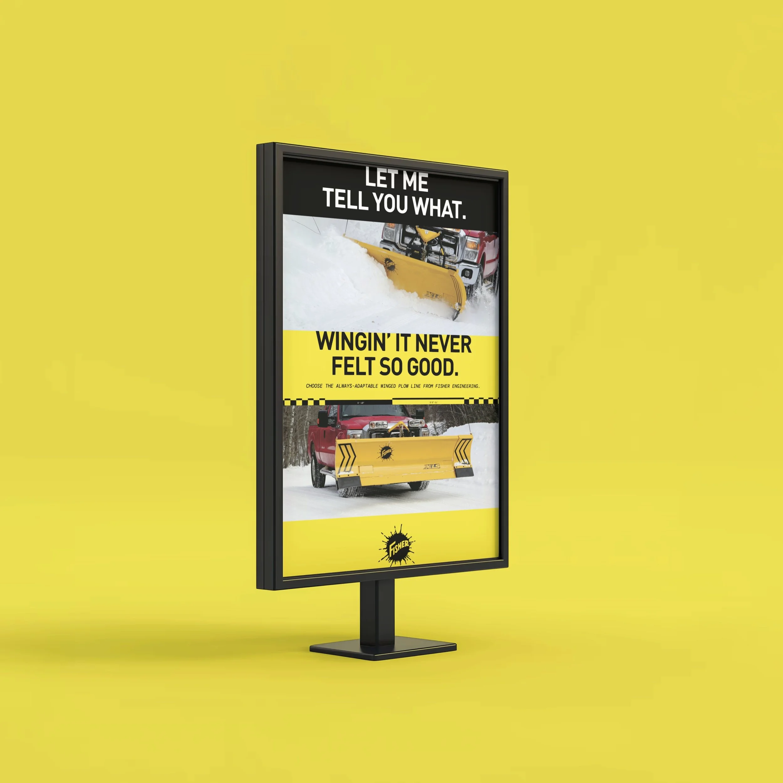 A digital billboard advertising Fisher Engineering's wing plow with snow-covered terrain in the background and a yellow wing plow attached to a red vehicle in front of trees.